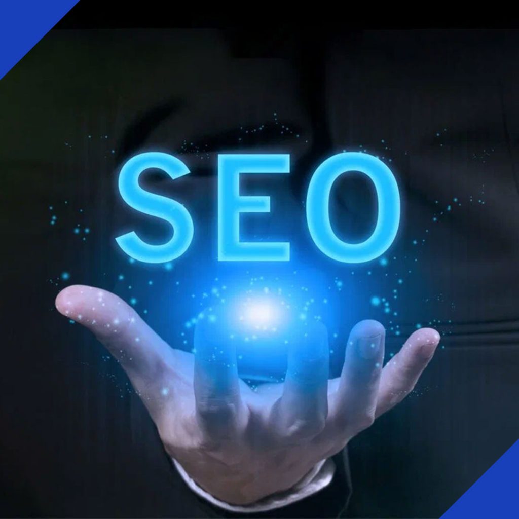 A hand holds a glowing, blue holographic projection of the word "SEO," symbolizing the powerful search optimization services offered by JR Digital Media.